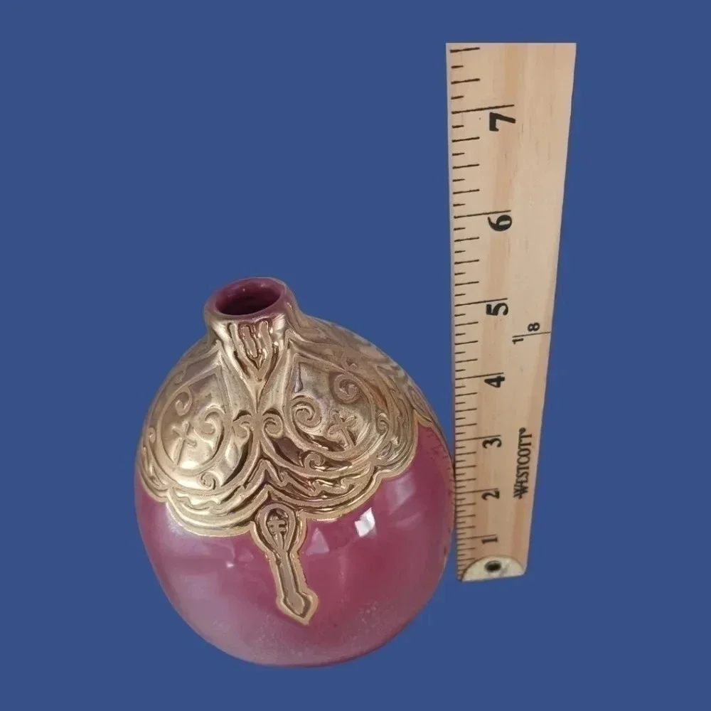 Vintage ceramic engraved  vase topped with enameled gold glazed
